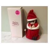 Collectible porcelain doll by Precious Moments
