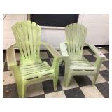 Two green plastic chairs