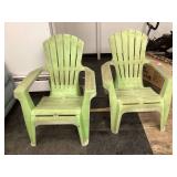 Two green plastic chairs