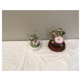 Two hummingbird musical figurines one with broken beak