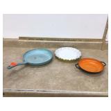 Two rustic cooking vessels