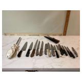 Various kitchen knives including chefs paring and bread knives