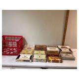 Old cigar and candy boxes in plastic crate