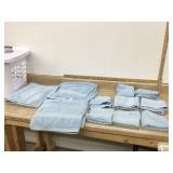 BATH TOWELS IN LAUNDRY BASKET