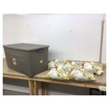 Five matching throw pillows in tote with lid