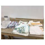 Vintage tablecloths in tote with lid