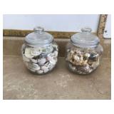 Two glass jars filled with seashells Two glass jars filled with seashells