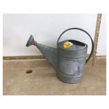 Old metal watering can Old metal watering can