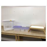 Three totes with lids and lap tray in laundry basket Three totes with lids and lap tray in laundry basket