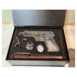 Glass pistol-shaped whiskey decanter set in box