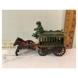 Heavy metal horses pulling decorative wagons