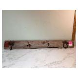 Rustic coat hat rack made of barn wood plank