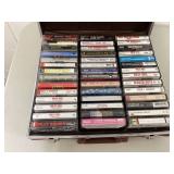 Collection of vintage cassette tapes in briefcase