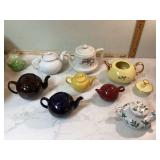 Collection of unique teapots including musical one