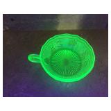 Green glass dish with grape design