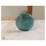 Large old glass jar with metal lid