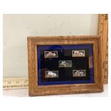 Collection of 5 framed stamp pins