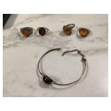 One silver bracelet 4 amber rings