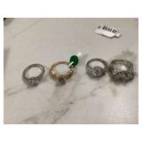 1 marked sterling silver ring and 3 unmarked rings
