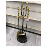 Fireplace tools with brass handles