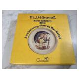 Collectible decorative plate featuring Hummel figurine in stormy weather