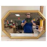 Golden octagon-shaped mirror with frame