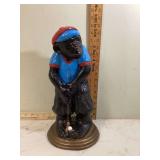 Vintage golfer statue with playful monkey design