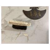 Antique metal axe and boat sculpture
