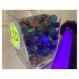 Antique glass jar with old marbles