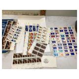old stamp collection with complete sheets of stamps