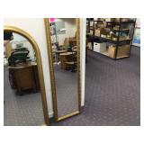 Gold curved-top wall mirror