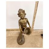 Brass boy statue with basket
