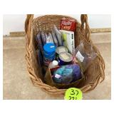 Cleaning supplies in basket - sponges gloves Comet