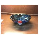 Blue glass fruit bowl with four feet
