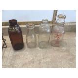 Old glass milk bottles in holder
