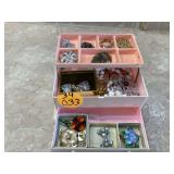 Box with various jewelry items inside
