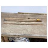 Vintage yard sticks and log scaling stick