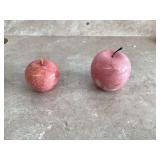 Two pink marble apple paperweights