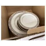 Red-orange floral design on white plates