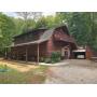 11.42 acres with home and 2 car garage