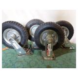 Pneumatic rubber tired casters. (4)Two swivel,