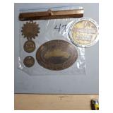 Brass advertising tags.
