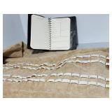 Pocket knife storage roll, log book