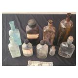 Nine Vintage Bottles