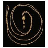 Gold watch fob with gemstones