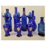 Blue glass cruets, vases, bottles