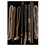 Long metal necklaces some with tassel charms