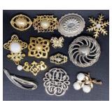 Pearl-like center Brooches