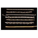 Gold and silver tone clasp bracelets