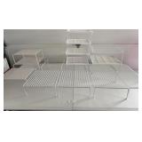 Racks for stacking items in cabinets